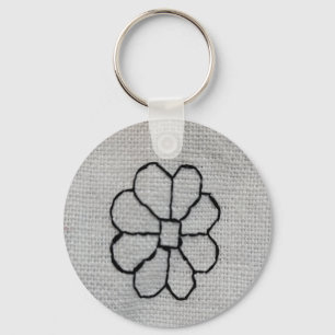 Zwart borduurwerk sleutelhanger