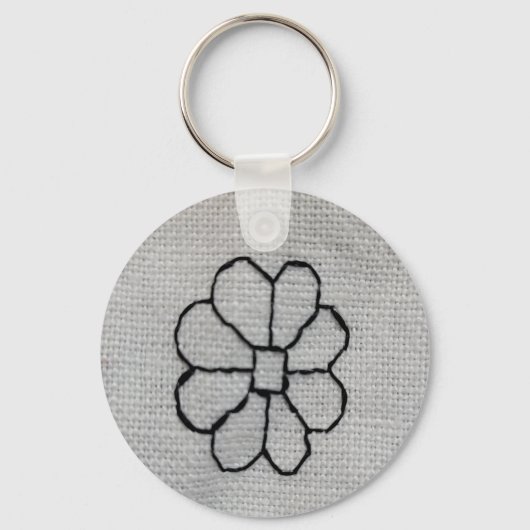 Zwart borduurwerk sleutelhanger (Voorkant)