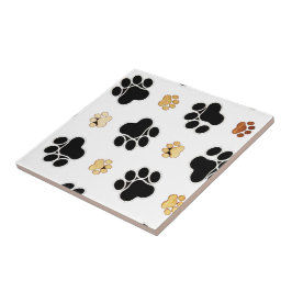 Zwart-bruine hondenpootjes tegeltje