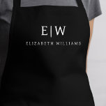 Zwart Elegant Modern Minimalistisch Monogram Naam Schort<br><div class="desc">Verhoog uw culinaire ervaring met onze Classic Elegant Modern Minimalist Monogram Name Cooking Schort. Deze essentiële keuken combineert tijdloze elegantie naadloos met hedendaags minimalisme. Dit schort is met precisie vervaardigd en is niet alleen een praktisch accessoire, maar ook een uiting van persoonlijke stijl. Met het aanpasbare monogram en de naamoptie...</div>