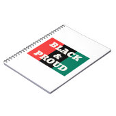 Zwart en gekleurd op een rode, zwarte en groene kl notitieboek (Linkerzijde)