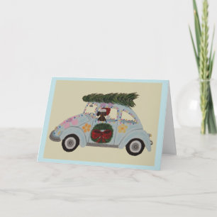 Zwart en roodbruine Dachshund in Hippie-auto met K Kaart