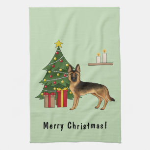 Zwart en roodbruine Duitse herder en een kerstboom Theedoek