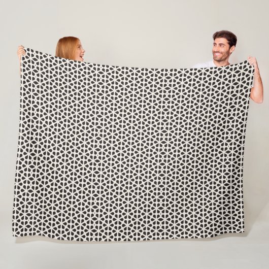 Zwart en wit geometrisch bloemmotief fleece deken (In situ)