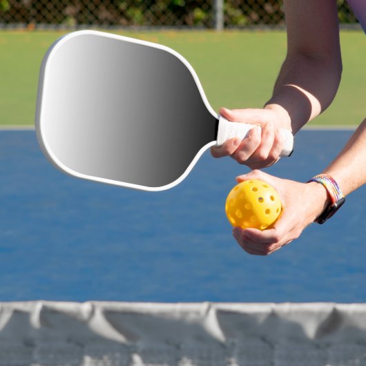 Zwart en wit pickleball paddle (Insitu)