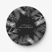 Zwart en wit pijnboomblad met sneeuw