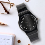 Zwart geborsteld metaal en witte monogram Initiale Horloge<br><div class="desc">Verhoog uw accessoire spel met deze Black Brushed Metal en White Monogrammed Initialen Watch! Het horloge heeft een chique zwarte geborstelde metalen achtergrond, aangevuld met schone witte typografische nummers rond de wijzerplaat. Personaliseer het met uw initialen of monogram in elegante witte scripttypografie onder de wijzers van het horloge. Een tijdloos...</div>