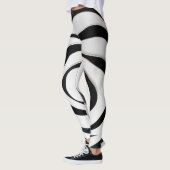 Zwart geometrisch spiraalvormig ontwerp op witte a leggings (Links)