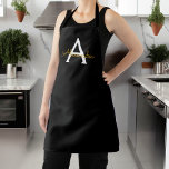 Zwart Gold Modern Script Girly Monogram Naam Schort<br><div class="desc">Naam zwart en goudmonogram Apron. Dit maakt de perfecte liefhebbende 16 verjaardag,  bruiloft,  vrijgezellenfeest,  verjaardagsdag,  baby shower of vrijgezellenfeest voor iemand die van luxe glam en stijl houdt.</div>