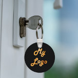 Zwart goud custom logo afbeelding business sleutelhanger<br><div class="desc">Voeg je eigen zakelijke logo toe. Zwarte achtergrond. Ideaal om uw bedrijf en merk te promoten</div>