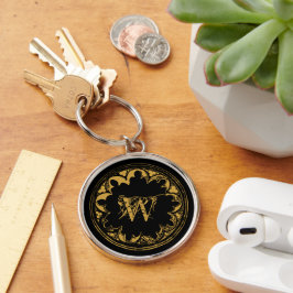 Zwart & goudbijtend monogram sleutelhanger