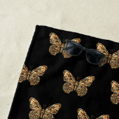 Zwart gouden vlinders patroon naam script strandlaken (In situ)
