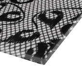 Zwart kant patroon op witte achtergrond snijplank (Hoek)