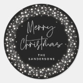 Zwart kerstscript met mousserende lampjes ronde sticker (Voorkant)