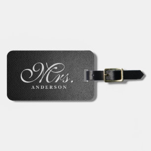 Zwart lederen achtergrond monogrammed bagagelabel