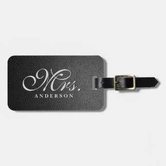 Zwart lederen achtergrond monogrammed bagagelabel