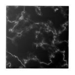 Zwart marmer effect tegel tegeltje<br><div class="desc">Op zoek naar een tegel die uw huis een elegante en geavanceerde aanraking kan geven? Kijk niet verder dan onze Tegel van het Marble Effect in klassiek zwart-wit. Het verbluffende marmereffect op deze tegel creëer een tijdloos en chic-gevoel van luxe, terwijl de contrasterende zwarte en witte kleuren een gewaagde uitspraak...</div>