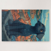 Zwart puppystandbeeld kijkt uit over de stad legpuzzel (Horizontaal)