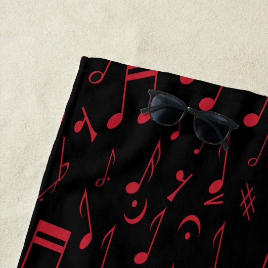 Zwart rood en wit muzieknoten strandlaken (In situ)