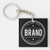 Zwart-wit cirkelvormig badge-logo sleutelhanger (Voorkant)