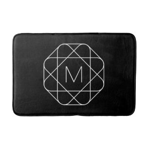 Zwart-wit geometrisch monogram badmat