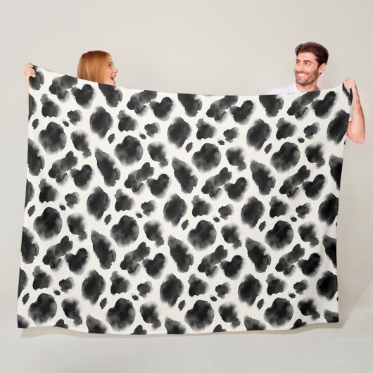 Zwart-wit koeienprintpatroon fleece deken (In situ)