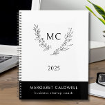 Zwart-wit Monogram Krans 2025 Planner<br><div class="desc">Zwart-wit monogram krans jaarplanner... De voorkant van onze klassieke zwart-wit planner toont een zakelijke logo van een sierlijke botanische krans die grenst aan uw twee monogram initialen in zwarte inkt... allemaal op een witte achtergrond. Jouw naam en titel (of bedrijfsnaam) verschijnen in witte inkt op een zwarte rechthoek aan de...</div>
