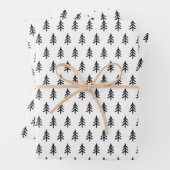 Zwart wit papier met kerstcadeautjes in de vorm va inpakpapier vel (In situ)