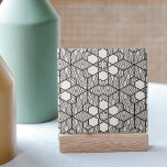 Zwart-wit Symmetrisch Geometrisch Mozaïek Tegeltje<br><div class="desc">Deze keramische tegel heeft een verbluffend geometrisch ontwerp dat zowel gedetailleerd als symmetrisch is. De monochromatische stijl bevat sterke, zwarte lijnen die weven en verbinden om een opeenvolging van boeiende patronen te vormen. Elk onderdeel van het ontwerp heeft een apart patroon dat visuele aantrekkingskracht toevoegt. De design zijn symmetrisch, met...</div>