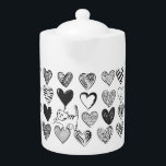Zwart-witkat en hartpatroon theepot<br><div class="desc">Een afspeelbare kattenhoes aan een hartvormige ballon omgeven door verschillende gepatterde harten in zwart-wit.</div>