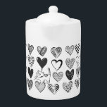 Zwart-witkat en hartpatroon theepot<br><div class="desc">Een afspeelbare kattenhoes aan een hartvormige ballon omgeven door verschillende gepatterde harten in zwart-wit.</div>