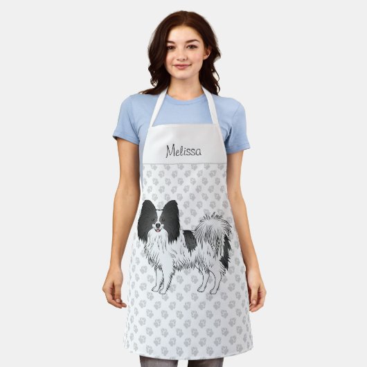 Zwart-witpapier met een twitteklare hond met aange schort (Gedragen)