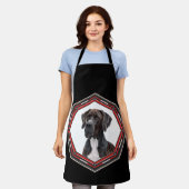 Zwart-Witte Dog Argenteuil In Een Rood Frame Schort (Gedragen)