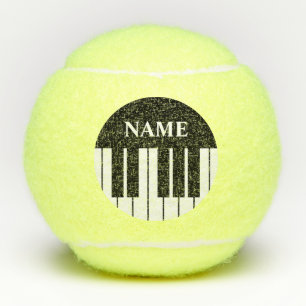 Zwart-witte grand pianotoetsen aangepaste naam tennisballen