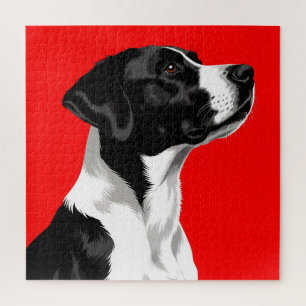 Zwart-witte hond op een krachtige rode achtergrond legpuzzel