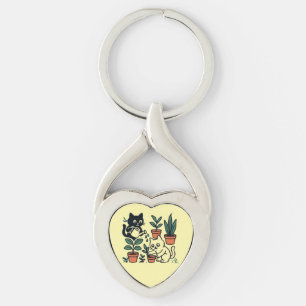 Zwart-witte katten tuinieren met planten sleutelhanger