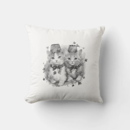 Zwart-witte kittens met petten kussen