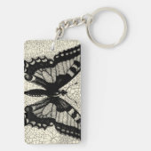 Zwart-witte vlinder op gekraakte achtergrond sleutelhanger (achterkant)