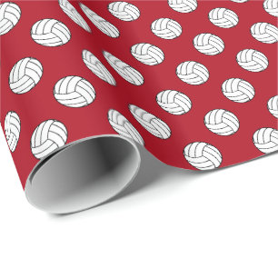 Zwart/witte volleybalballen op donkerrood cadeaupapier