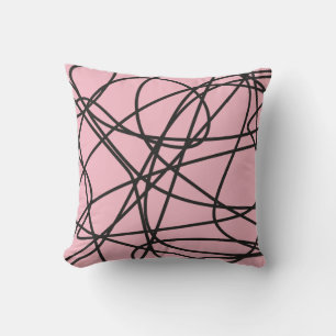 Zwarte abstracte krabbel op roze kussen