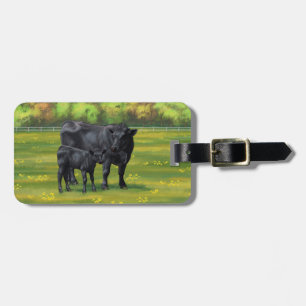 Zwarte Angus-Koe en Cute Calf in zomerperiode Bagagelabel