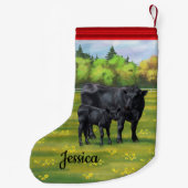 Zwarte Angus-Koe en Cute Calf in zomerperiode Kleine Kerstsok (Achterkant)