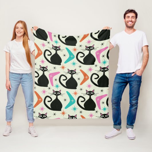 Zwarte atoomkatten en boemerangs uit het midden va fleece deken (In situ)
