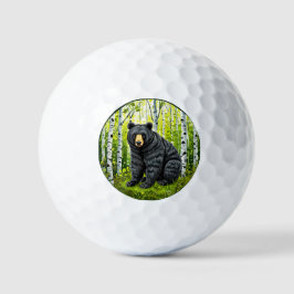 Zwarte beer in een berkenbos golfballen