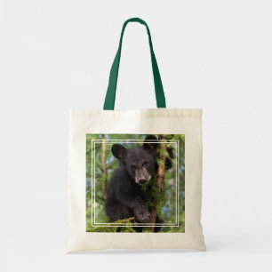 Zwarte beerwelp speelt in bomen tote bag