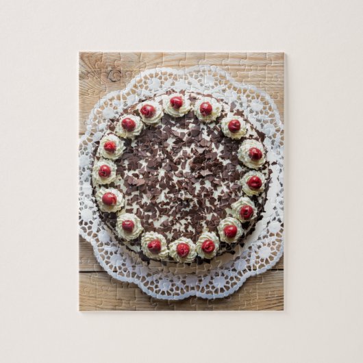 Zwarte boscake op bijthout legpuzzel (Verticaal)