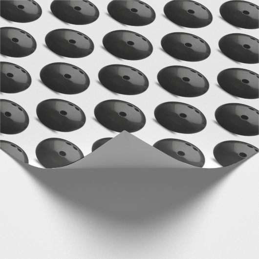 zwarte bowlingbal op wit cadeaupapier (Hoek)