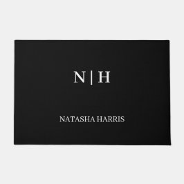 Zwarte deurmat met bedrijfslogo