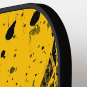 Zwarte en gele verfspatten pickleball paddle (Links Detail)