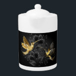 Zwarte en goudvogel theepot<br><div class="desc">Zwarte en gouden sieraden kolibries op grijze achtergrond versierd met planten. Sieraden vogels. Gouden vogel. Gouden vogel.</div>